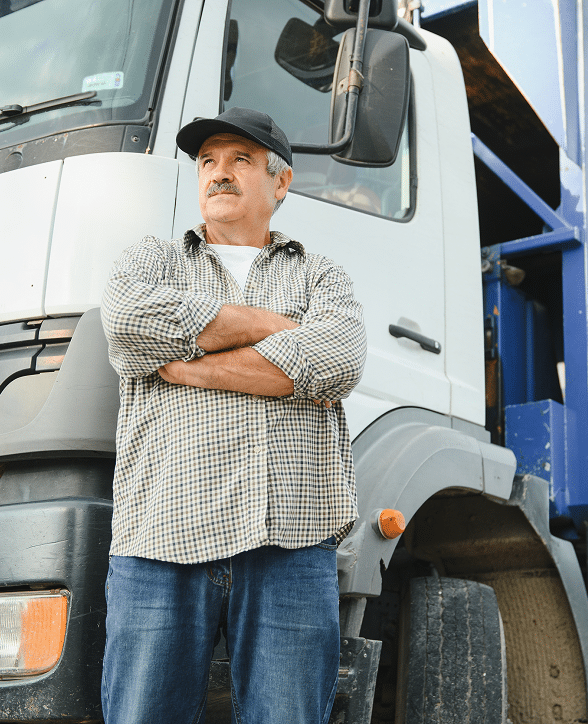 Truck driver standing next to a commercial vehicle – personal lines insurance Nebraska | CRS Group