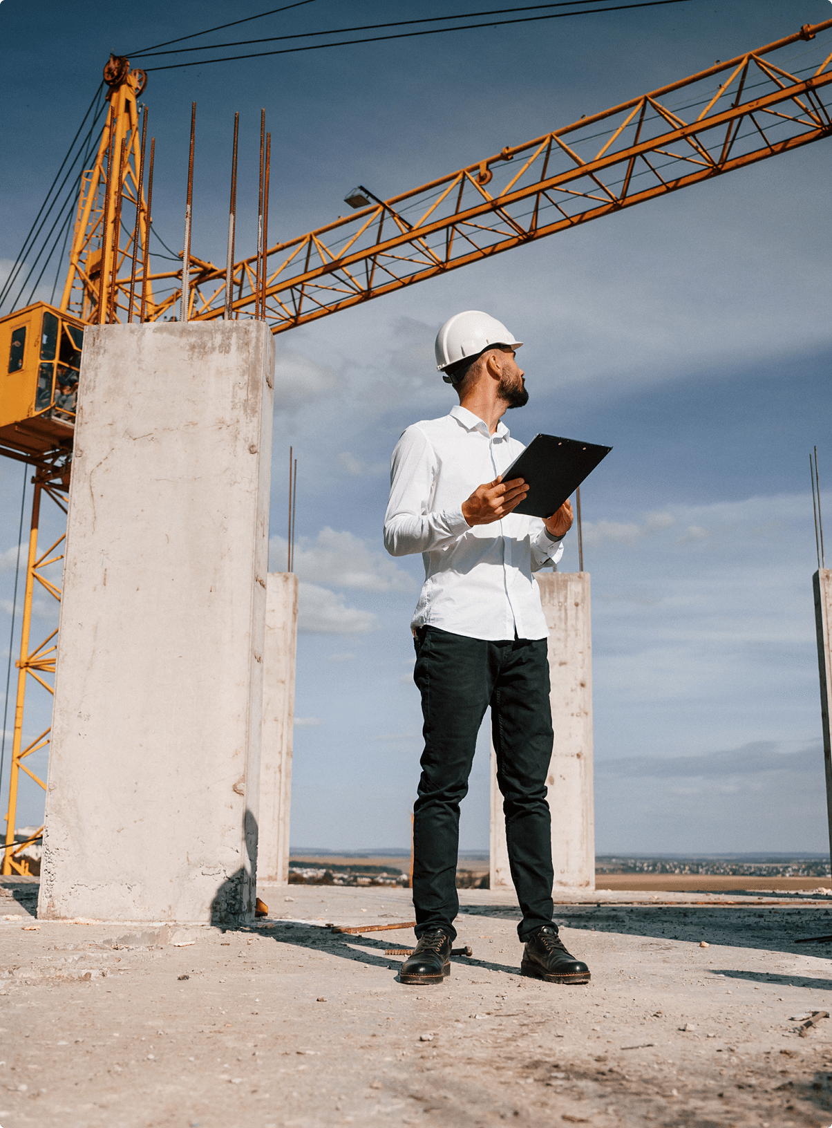 Construction engineer with clipboard inspecting a job site – surety bonds Nebraska | CRS Group