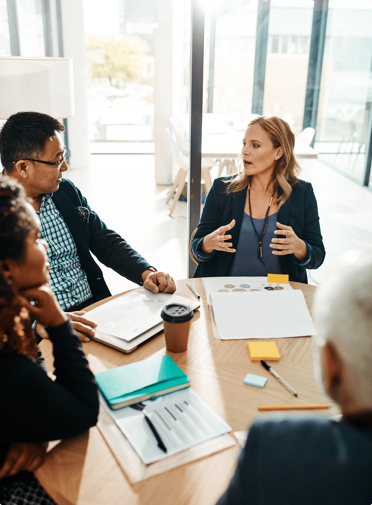 HR manager presenting employee benefits options to a team – group health insurance Nebraska | CRS Group