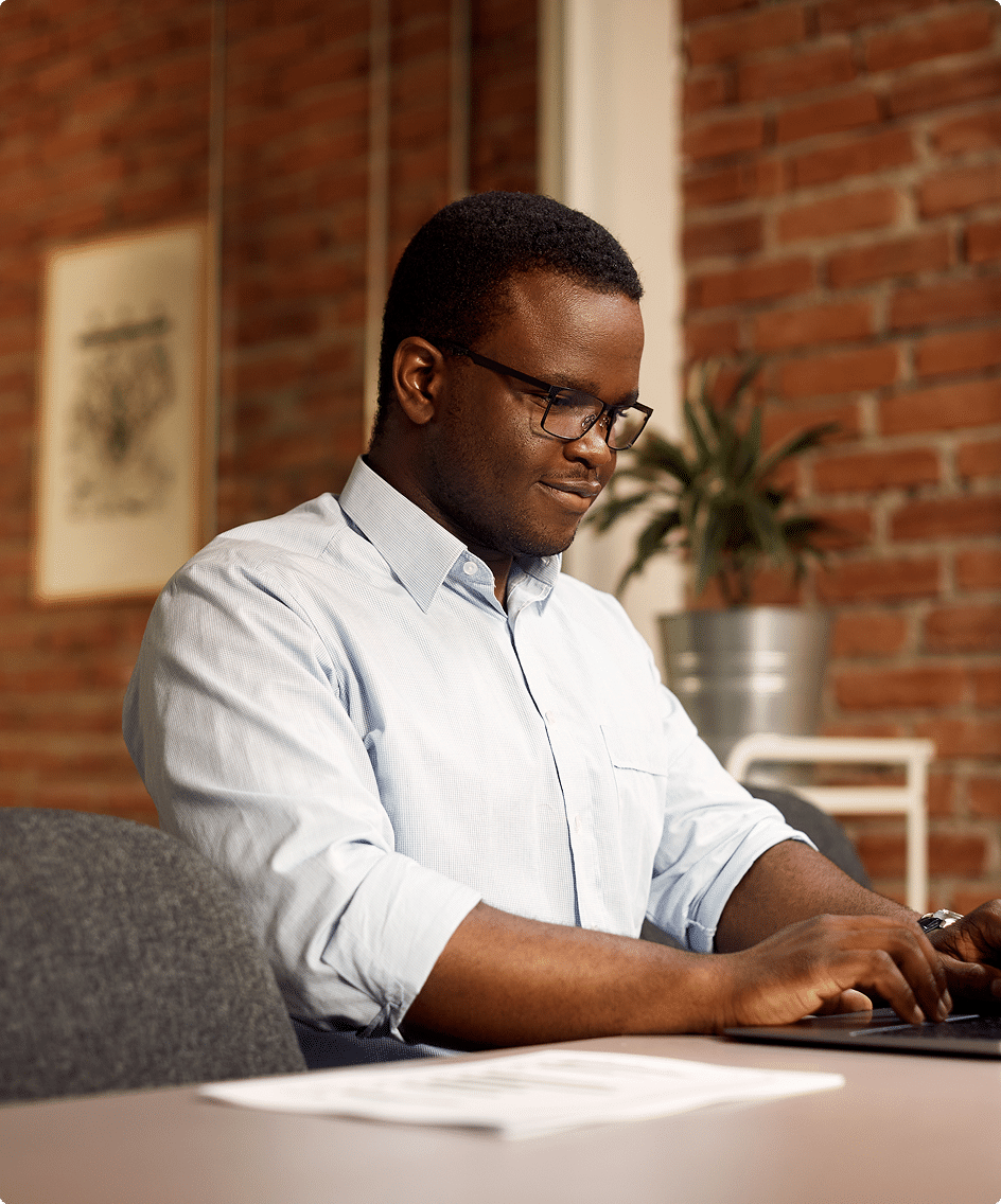 Business professional working at a desk – get in touch with CRS Group